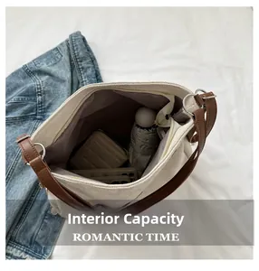 Detail view of large canvas tote bag internal capacity with zipper pocket for essentials
