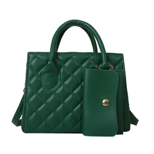 Green quilted leather tote bag with matching pouch and gold hardware on white background