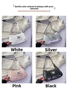 Detail view of four stylish underarm bags with heart buckles in silver and pink