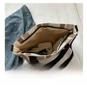 Interior view showing the large capacity of the striped canvas tote bag with various items