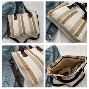 Detail view of large capacity striped canvas tote bag with zipper and inner compartment