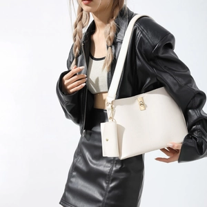 Chic off-white leather bucket bag 3-piece set with gold hardware on female model