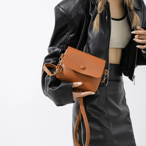 Retro brown PU leather envelope crossbody bag with adjustable strap on model
