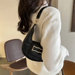 Chic black crescent hobo bag with quilted stitching and gold hardware for women