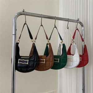 Chic quilted crescent shoulder bags in five colors with golden metallic buckles on display