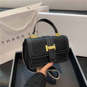 Black woven leather handbag with gold H buckle and white contrast stitching detail