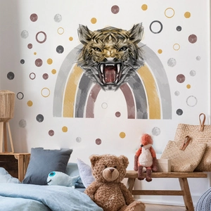Detail of cartoon tiger and rainbow wall decal in a cozy children bedroom setting