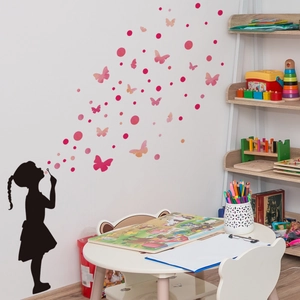 Pink butterfly and girl silhouette wall stickers for kids room decor in a cozy nursery