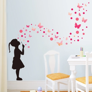 Girl blowing bubble wall sticker with pink butterflies and dots for nursery decor