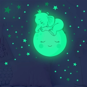 Luminous wall sticker with cartoon elephant on a smiling moon and glowing stars set