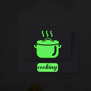 Glow-in-the-dark wall sticker featuring a cooking pot icon and text on a light switch