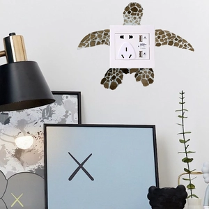 Detailed sea turtle wall sticker surrounding a white light switch on a clean wall