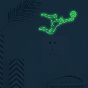 Glow in the dark soccer player wall sticker showing bright luminous green sports silhouette