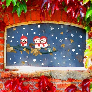 Christmas owl stickers on branches with snowflakes for festive holiday window decoration