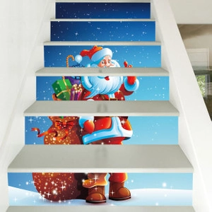 Adhesive PVC stair stickers showing Santa Claus carrying a gift bag in a snowy scene