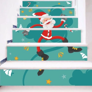 Detailed view of Christmas Santa Claus PVC stair stickers on indoor white steps