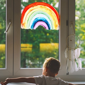 Rainbow window static sticker for home decor featuring a child looking at soft colorful art