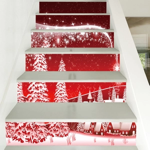 Detail of red Christmas stair stickers with snow trees and houses on white steps