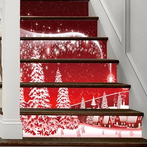 Detail of Christmas staircase decals featuring festive red and white snowflake cabin motifs