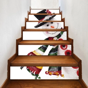 Festive snowman PVC stair riser stickers set featuring a snowman in a hat on a wooden stairs
