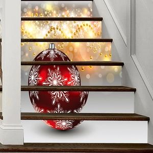 Detail of Christmas staircase sticker with red ornament, snowflakes and golden bokeh lights
