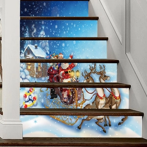 Detail of Christmas stair stickers featuring Santa, reindeer, and snowy winter night scene
