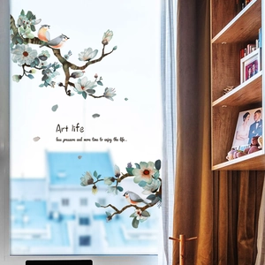 Detailed view of ink painting style window film with birds and floral branch decoration