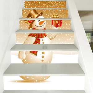 Detail of Christmas snowman stair decals with gift box on gold snowy background
