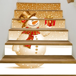 Detailed view of snowman Christmas stair stickers on wooden steps for holiday home decor