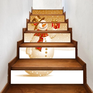 Detail view of 6-piece Christmas snowman stair stickers on wooden steps decor