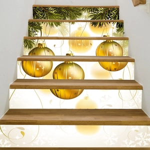 Detail of Christmas stair stickers with golden ornaments, pine needles and white snowflakes