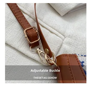 Detail of adjustable brown leather strap with premium gold metal buckle and hook