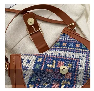 Detail of bohemian geometric jacquard fabric with premium metal magnetic buckle on bag
