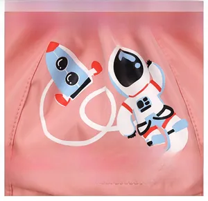 Detail of pink nylon fabric with cartoon astronaut print and neat stitching for kids backpack