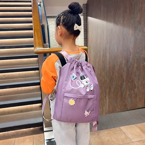 Detail of purple waterproof nylon kids drawstring backpack with cartoon astronaut patch