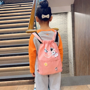 Detail view of pink nylon drawstring backpack for kids with cute cartoon appliques