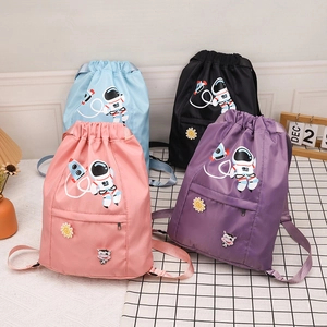 Kids nylon drawstring backpacks featuring cartoon astronaut and cow patterns in four colors