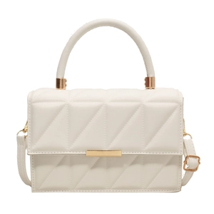 Minimalist beige quilted square handbag with gold hardware and circular top handle