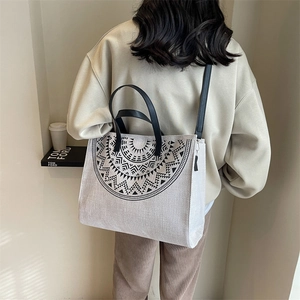 Large capacity canvas tote bag with black geometric print and dual straps for women