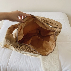 Quilted space cotton cloud tote bag featuring spacious interior with zipper pockets