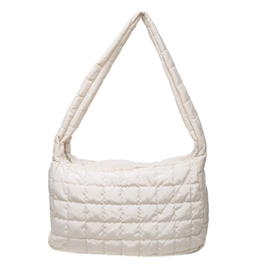 Quilted puffer tote bag in cream white with a soft padded finish and zip closure