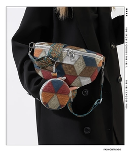 Detail of colorful geometric patchwork waist bag with matching round coin purse on black suit