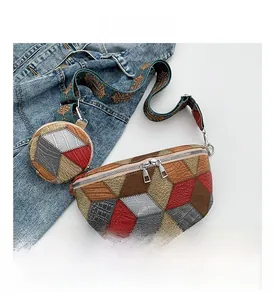 Detail view of colorful patchwork fanny pack with textured leather and ethnic strap