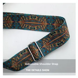 Close-up of bohemian woven shoulder strap with blue orange patterns and silver buckle