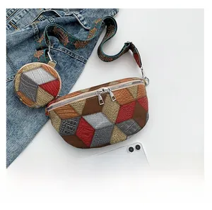 Detail of multi-color leather patchwork chest bag with broad strap and small coin purse