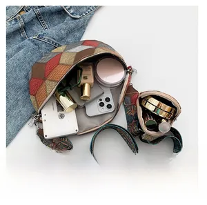 Flat lay of colorful patchwork crossbody bag showing spacious interior with cosmetics