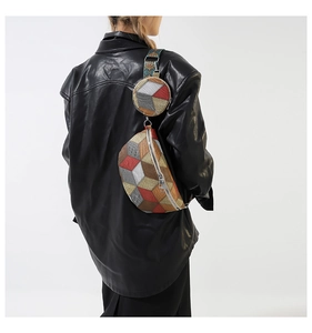 Detail of colorful geometric 3D cube jacquard waist bag with matching round coin purse
