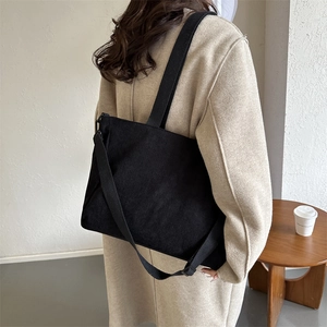 Retro black corduroy bucket tote bag with adjustable shoulder strap for women's daily commute