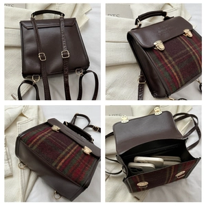 Detail of vintage plaid patchwork backpack showing interior space and golden hardware