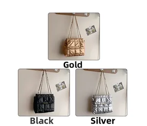 Detailed view of quilted chain shoulder bags in gold, black, and silver metallic finishes